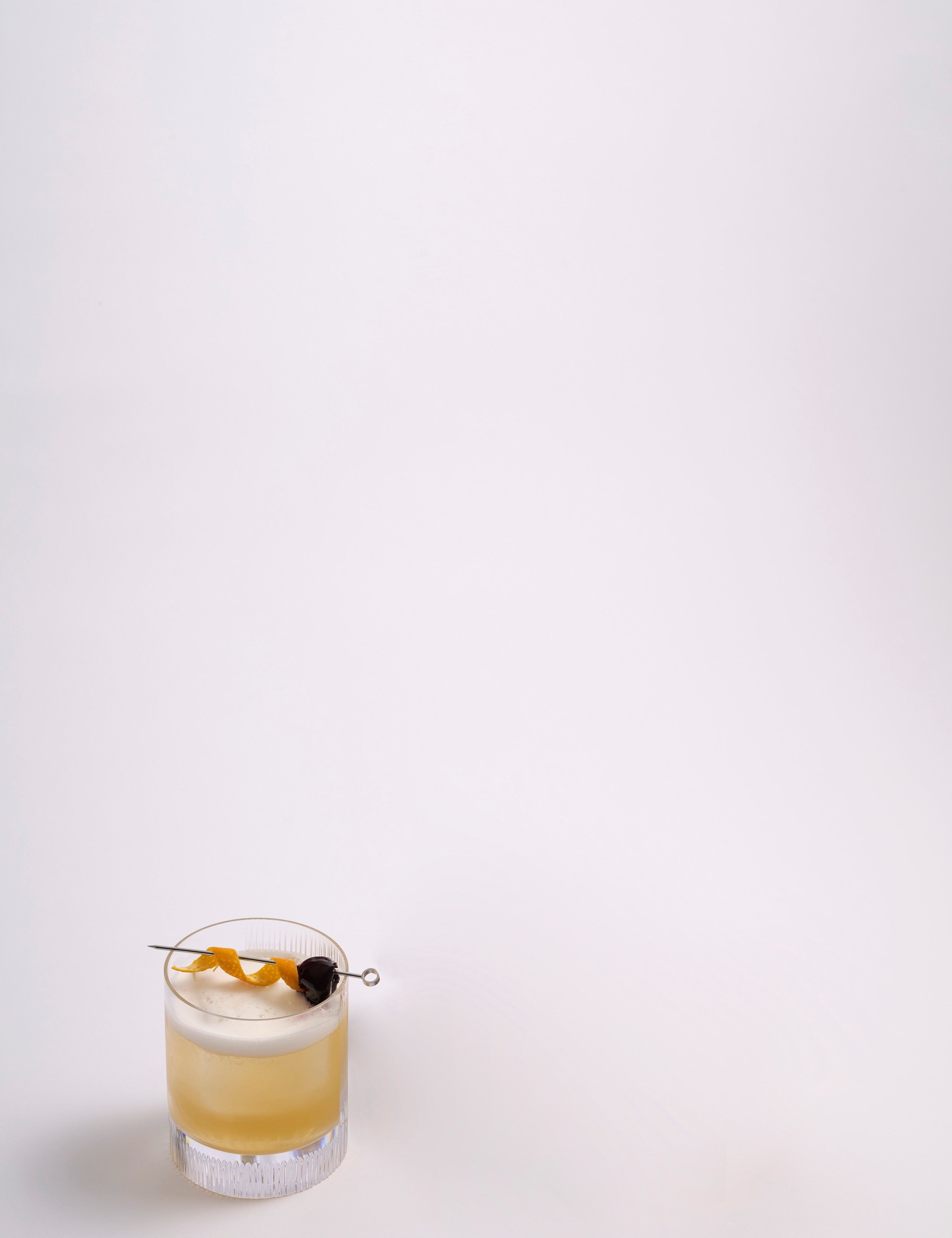 Whiskey_Sour_Cocktail_on_White.jpg